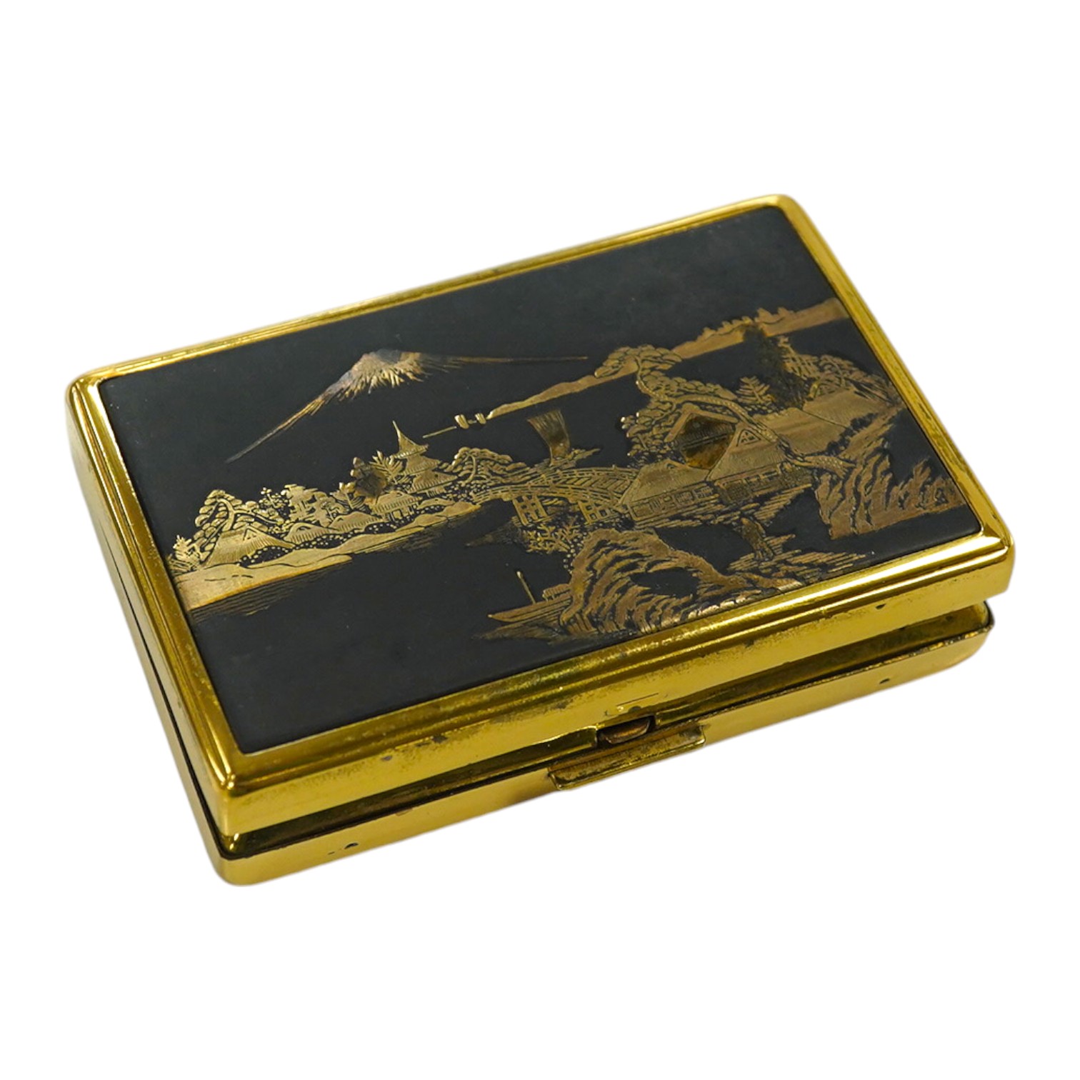 A Japanese damascened iron and gilt metal musical compact, 9cm wide. Condition - fair